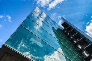 Commercial exterior building looking up at blue sky